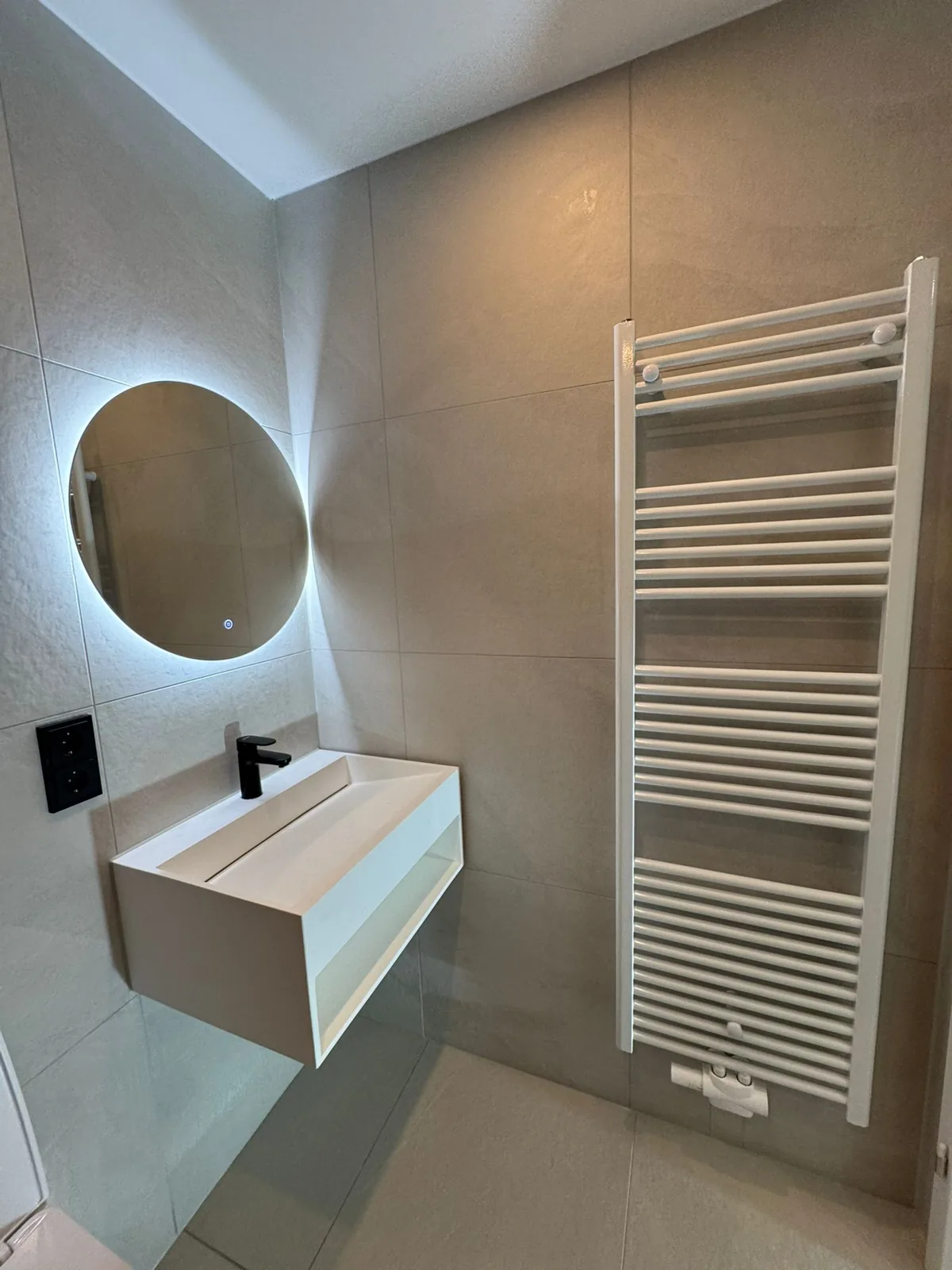 Finished vanity and fixtures in the renovated bathroom