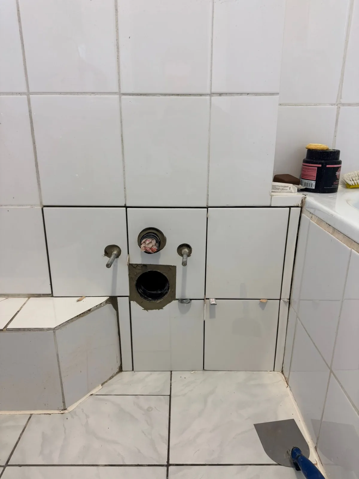 Finished bathroom with the signature clean-tiled look