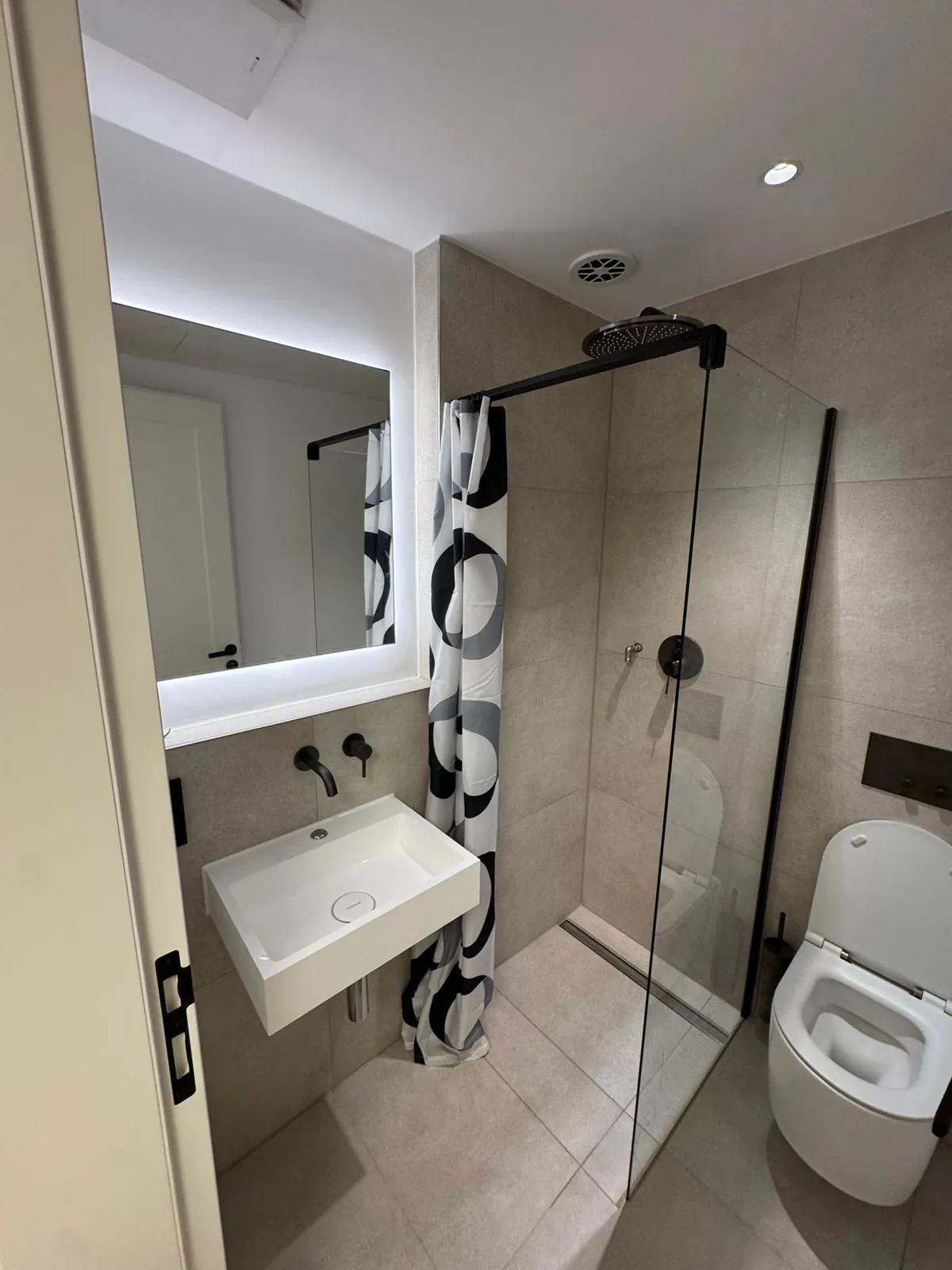 Finished bathroom with walk-in shower in Munich