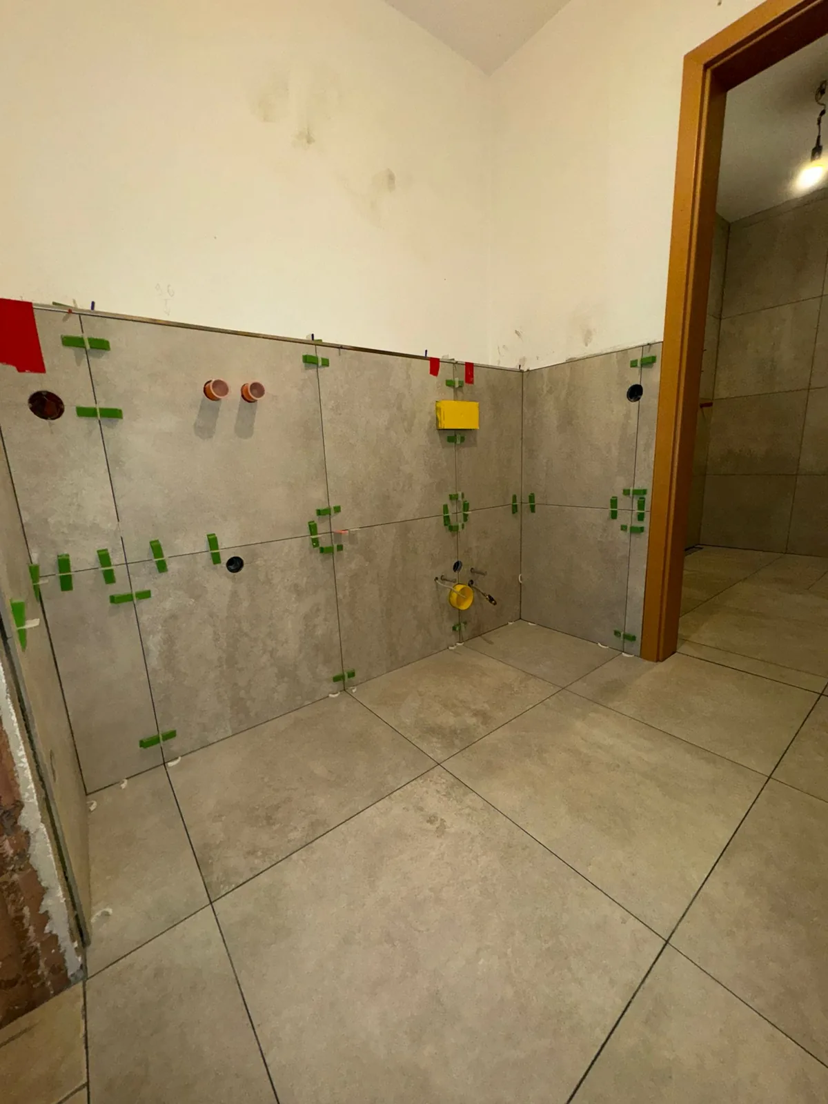 Finished large-format wall and floor tiling