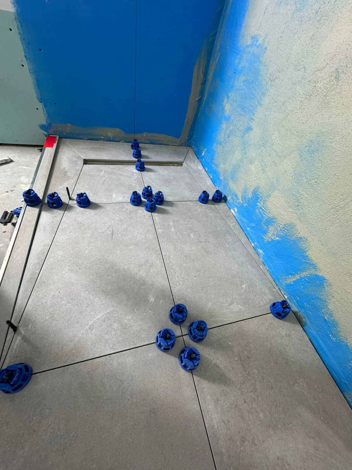 Blue waterproof tanking membrane applied in a wet room