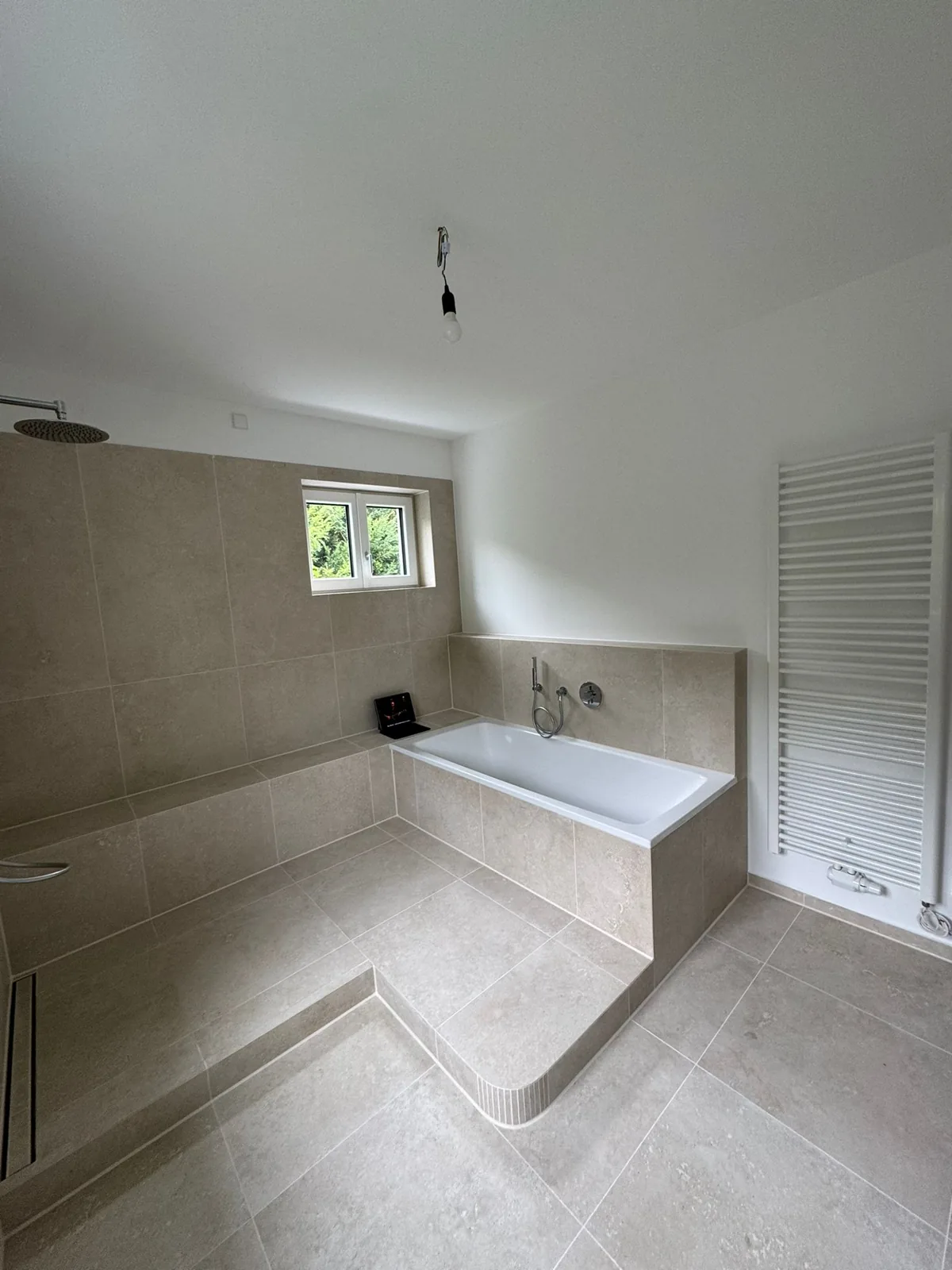 Finished attic loft conversion with clean drywall and skylight