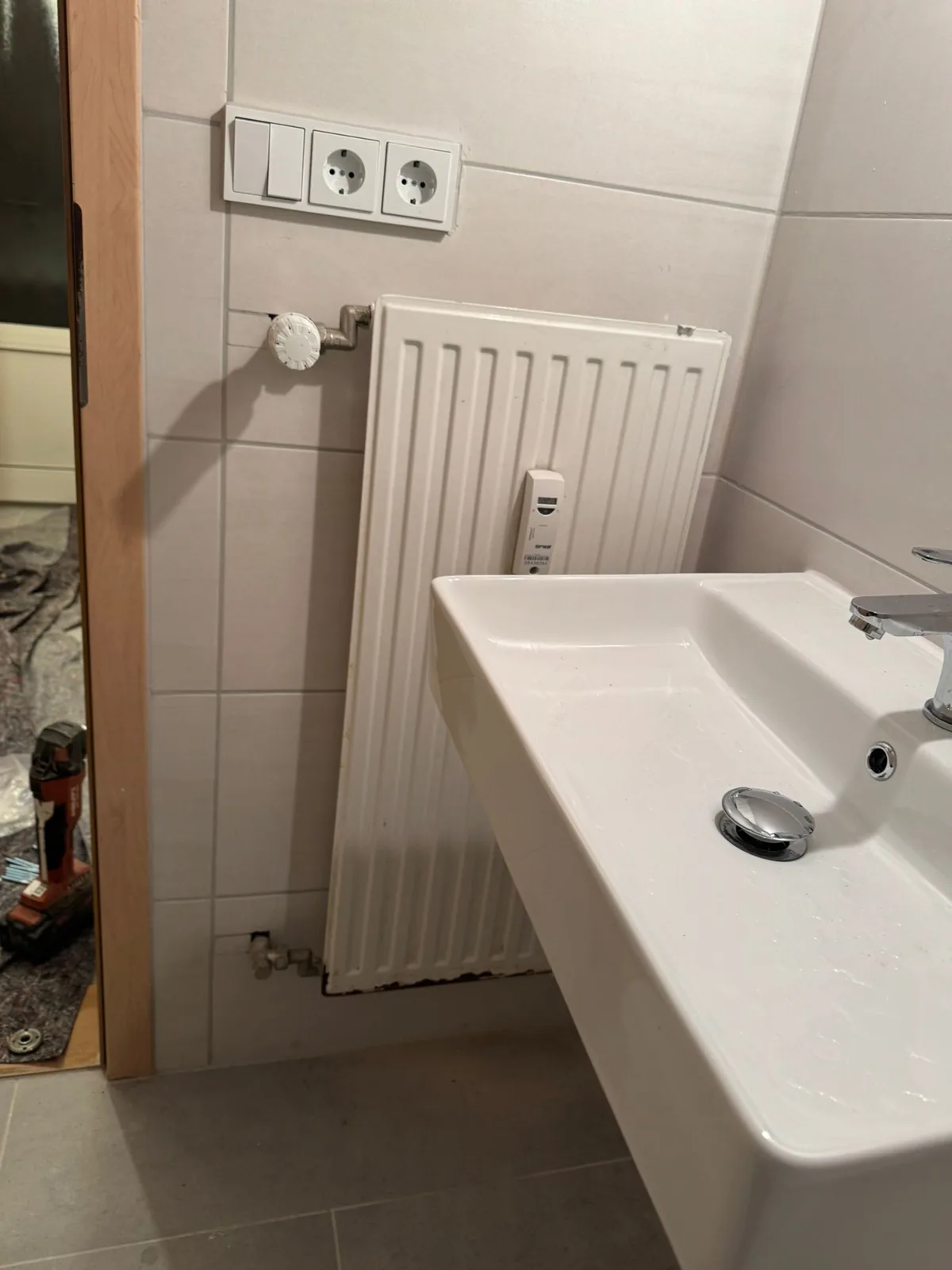 Radiator removed from the wall for a heating repair